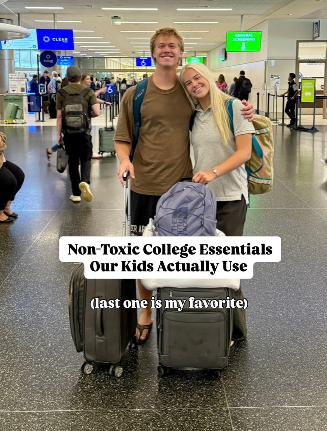 Two college students hugging at the airport with backpacks and rolling suitcases